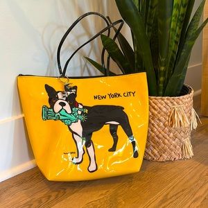 This is a yellow Marc Tetro bag with a keychain and extra bag included